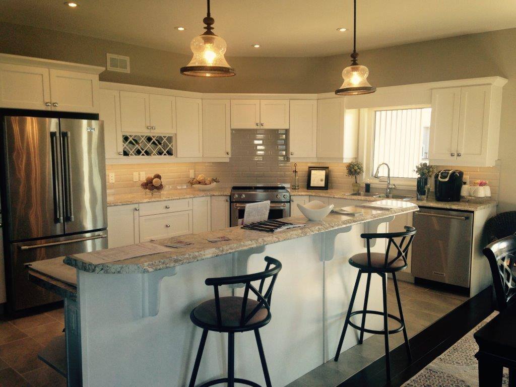 Traditional kitchen with granite countertops and cream cabinets