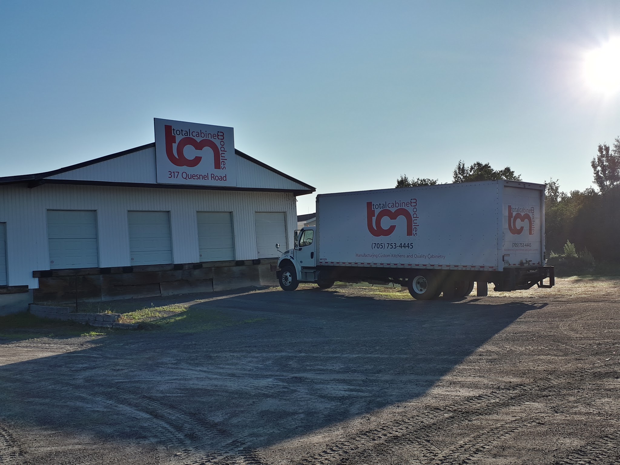 TCM storefront and delivery truck on Quesnel Road